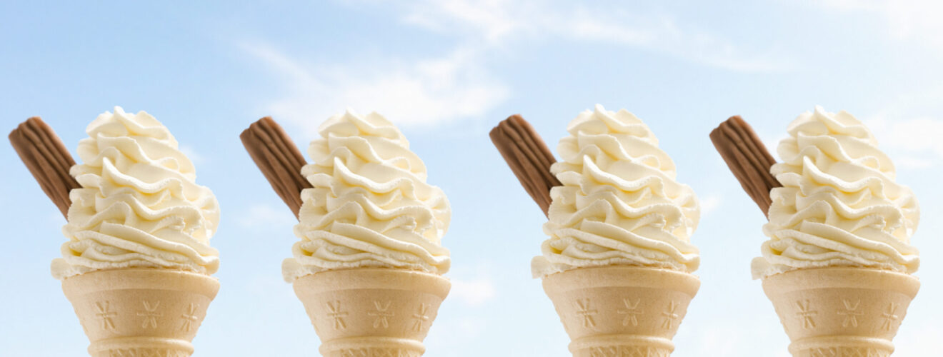 Ice Cream Cones with chocolate flakes against a blue sky
